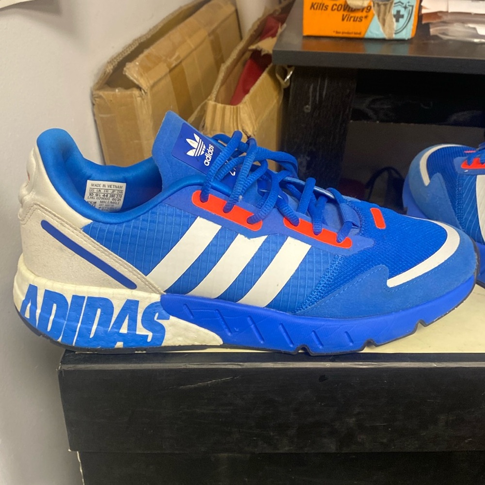 Blue and orange adidas ZX 1K boost sneakers